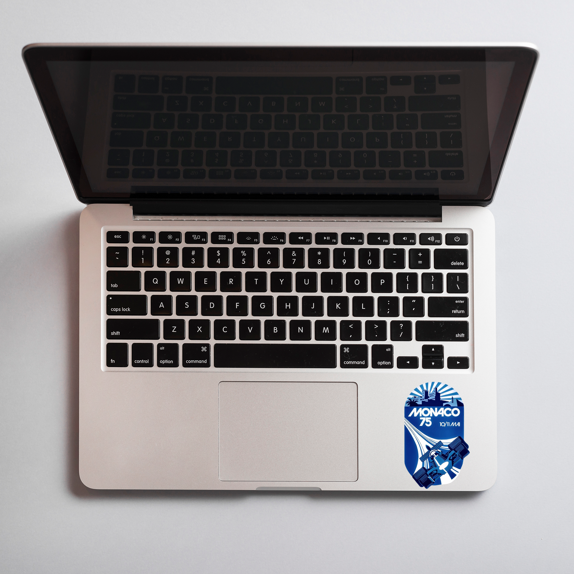 F1-Monaco sticker on an open laptop.